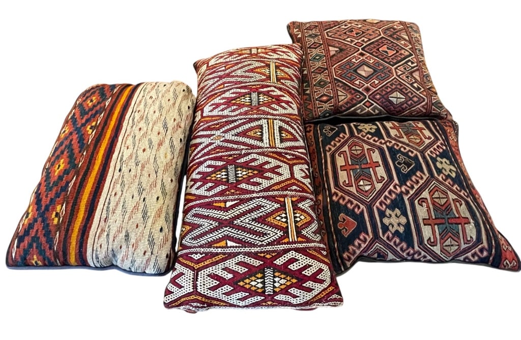 4 VINTAGE SOUTHWESTERN PATTERNED PILLOWS: Four vintage pillows featuring distinctive kilim-inspired patterns. Each pillow displays unique geometric motifs and vibrant colors, making them ideal accents for eclectic d?cor. Excellent for adding 