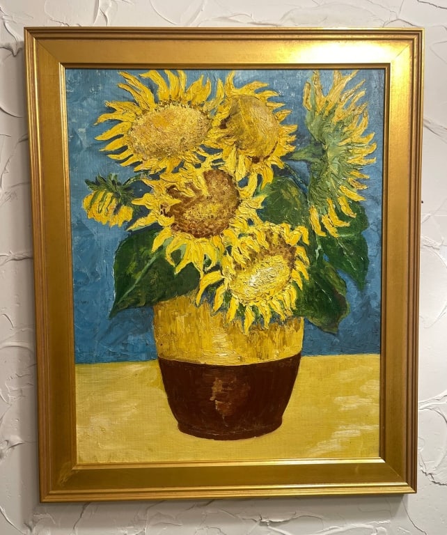 FRAMED SUNFLOWERS OIL PAINTING 23X19 INCHES: Colorful oil painting of sunflowers in a vase, framed in gold. The artwork measures approximately 23 inches tall by 19 inches wide with the frame. Ideal for home or office wall decor.