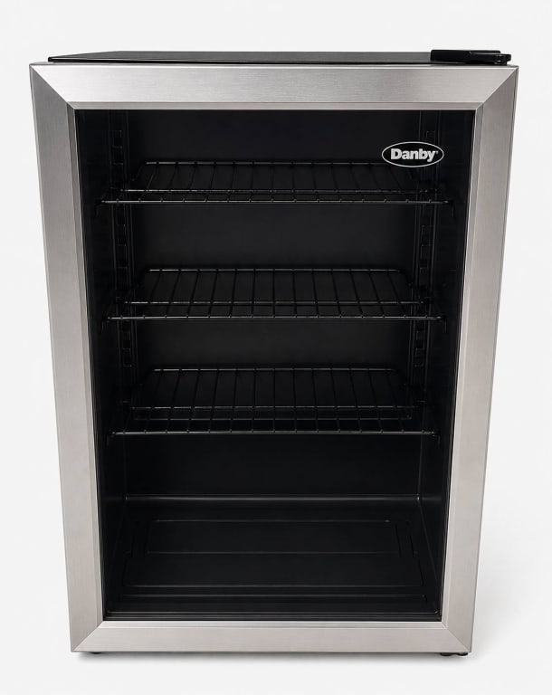 DANBY STAINLESS STEEL BEVERAGE COOLER 32": Danby stainless steel beverage cooler with glass door and three wire shelves. Features a compact design suitable for home or office use. Item appears in good condition with minimal signs of wear. Func