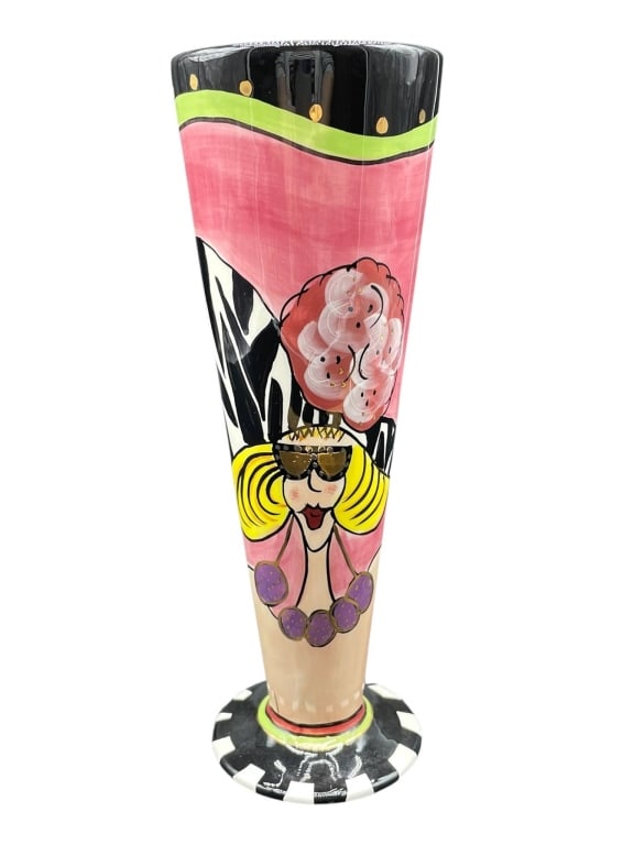 CHARACTER COLLECTIBLES HAND PAINTED VASE 10": Hand painted Glam Girl ceramic vase from the Character Collectibles series. Features a whimsical female character design with vibrant pink, black, and yellow accents. Signed on the base. Measures appr