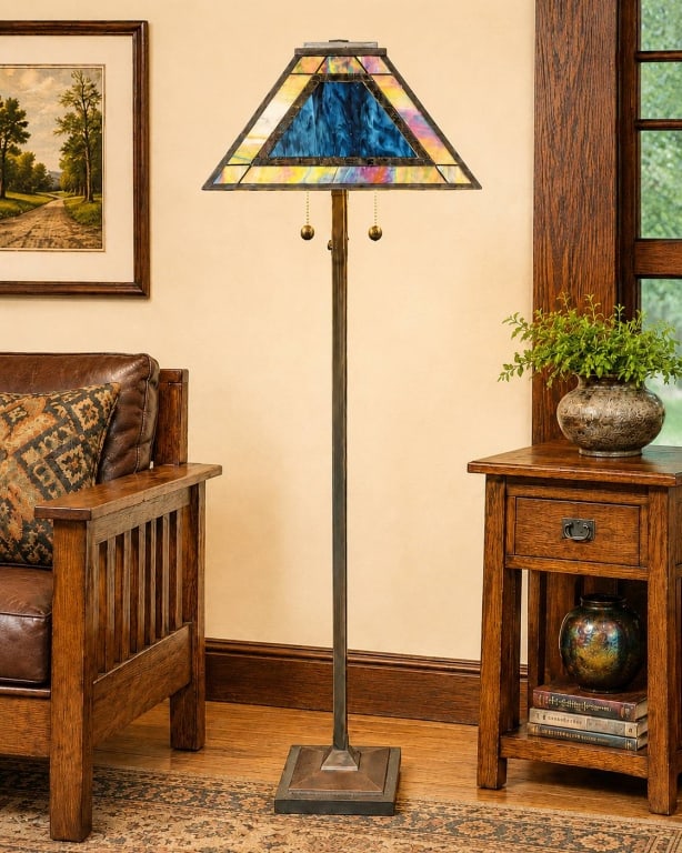 DALE TIFFANY STYLE STAINED GLASS FLOOR LAMP 63": This floor lamp features a stained glass shade in vibrant colors and a sturdy, pyramid-shaped metal base. The pull chain is marked "Dale," indicating a Tiffany-style design. The lamp displays quality 