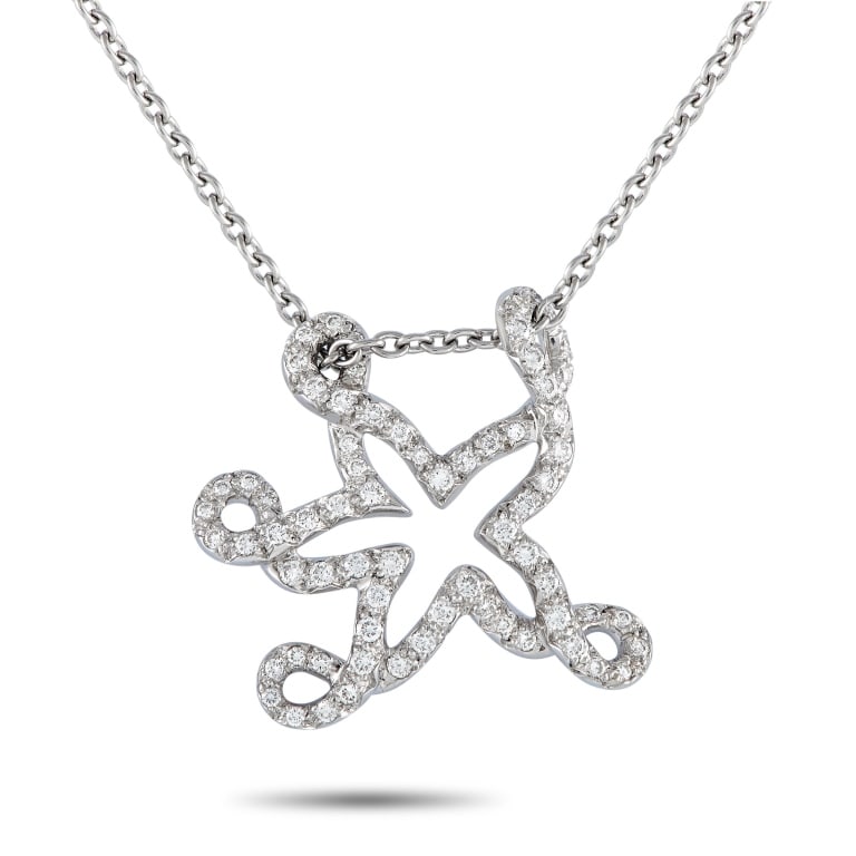 DIOR 18K WHITE GOLD 0.65CT DIAMOND STARFISH NECKLA: With its whimsical silhouette and captivating yet elegant sparkle, this necklace is bound to be the star of every outfit. This creation by Dior features a 16-long necklace with a spring ring clasp. It