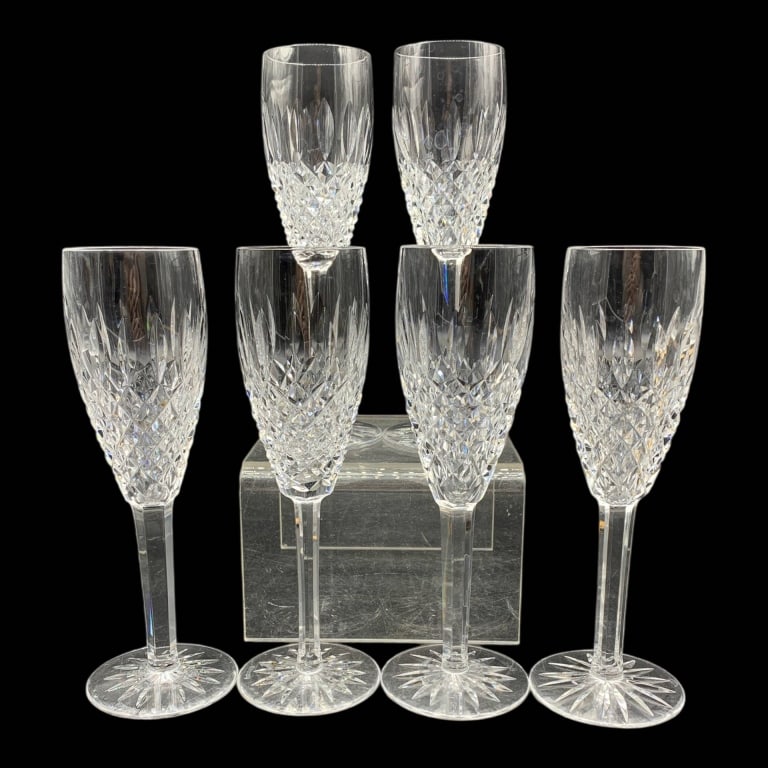 WATERFORD CRYSTAL CHAMPAGNE FLUTES SET OF 6, 9": Six Waterford cut crystal champagne flutes, featuring intricate starburst and diamond patterns. Each flute measures approximately 9 inches tall. 2" glass opening. Excellent condition, ideal for elegan