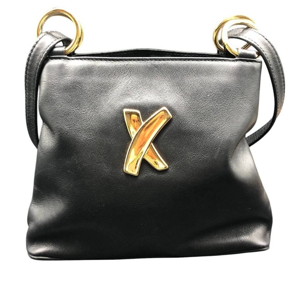 PALOMA PICASSO BLACK LEATHER CROSSBODY BAG 10": Elegant vintage Paloma Picasso crossbody bag in black leather featuring gold-tone hardware, including signature 'X' logo accent. Made in Italy. The bag is clean inside with multiple compartments and i