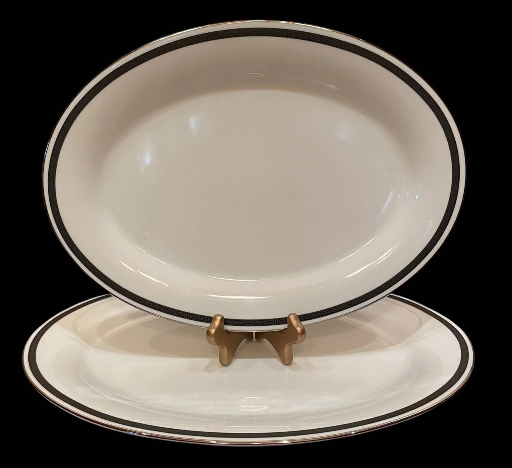 NORITAKE HORIZON LARGE OVAL PLATTER PAIR 14": Noritake Horizon large oval platters. Elegant white porcelain with black and silver rim. Each platter measures approximately 14 inches long. Both pieces are in very good condition, ideal for serving o