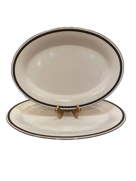 NORITAKE HORIZON LARGE OVAL PLATTER PAIR 14": Noritake Horizon large oval platters. Elegant white porcelain with black and silver rim. Each platter measures approximately 14 inches long. Both pieces are in very good condition, ideal for serving o