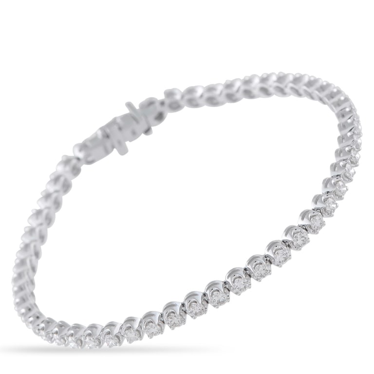 LB EXCLUSIVE 14K WHITE GOLD 2.55CT DIAMOND TENNIS: Day or night, this tennis bracelet adapts to any look. It's fashioned in 14K white gold and carries a total of 2.55 carats of diamonds, each set to catch light from every angle. The generous carat wei