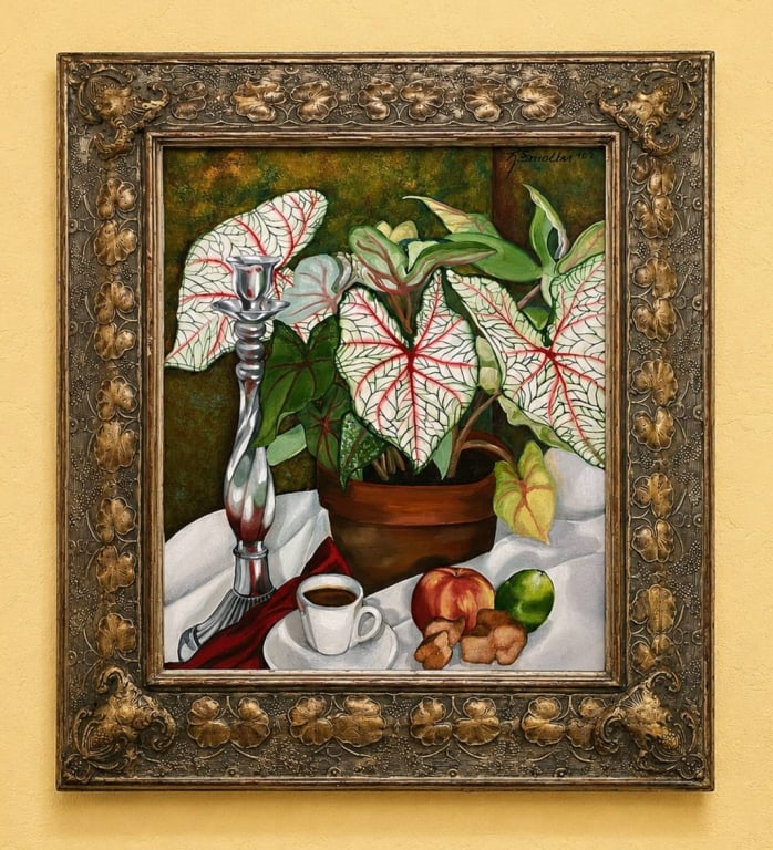 STILL LIFE PAINTING WITH PLANTS AND FRUIT 28": Original still life painting features a potted plant with green and white variegated leaves, fruit, a cup of coffee, and a silver candlestick on a white cloth. Set in an ornate gold-toned frame, total