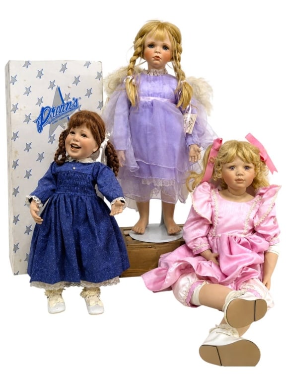 3 CHRISTINE ORANGE KAYE WIGGS & DRENA DOLLS SET: Three artist collectible dolls. The pink satin doll is a Christine Orangelimited-edition porcelain artist doll, signed and numbered 372/500, but she is not in her original box. | | The lavender angel 