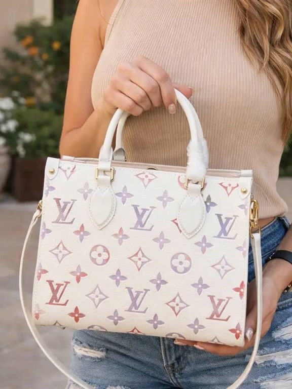 UPCYCLE PASTEL LV SATCHEL BAG: Upcycled Pastel LV Satchel | | Soft, feminine, and a total eye-catcher | This pastel LV satchel features a structured shape with top handles and a removable strap for easy crossbody wear. | | The perf