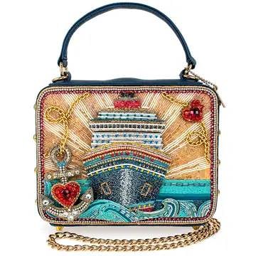 NEW MARY FRANCES FULL STEAM AHEAD BAG: The 'Full Steam Ahead' handbag takes you on a glamorous voyage with its intricately beaded cruise ship design and sparkling ocean waves. With bold nautical elements like a jeweled anchor and radiant s