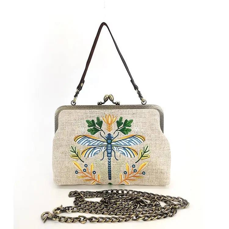 NEW DRAGONFLY KISSLOCK BAG: Embrace the beauty of nature with the Dragonfly Vintage Kisslock Bag, an elegant accessory that captures the delicate and graceful charm of dragonflies. This bag blends nature-inspired design with vin
