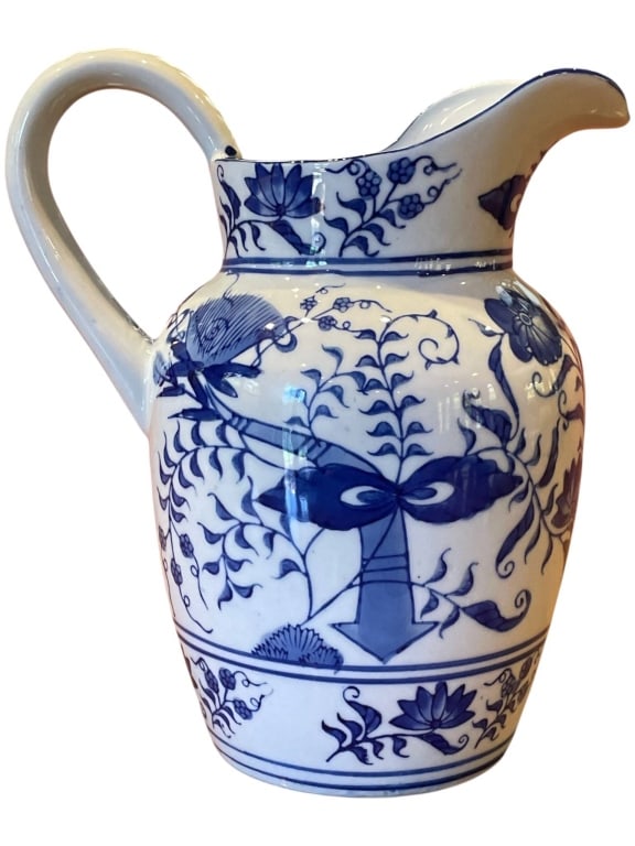 VIENNA WOODS CHINOSERIE PITCHER 9": Vienna Woods Fine China pitcher featuring classic blue and white floral decoration with vine, leaf, and blossom motifs throughout the body. The piece has a rounded form with applied handle, shaped pou