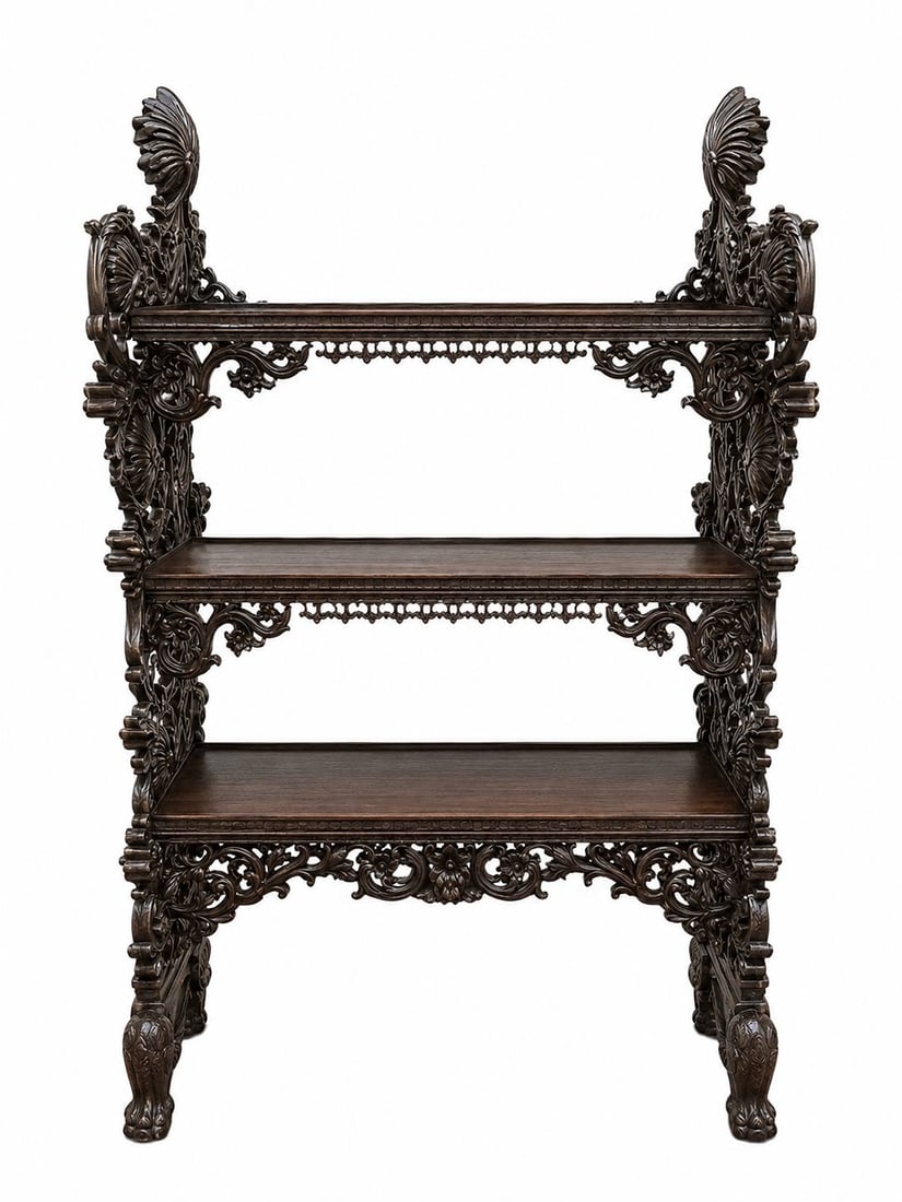 ANTIQUE CARVED WOOD DISPLAY ETAGERE 72": Elaborately carved, dark-stained wood display ?tag?re with three shelves. Features intricate detailing, scrollwork, and ornate cresting, likely late 19th century. A decorative piece for traditional or