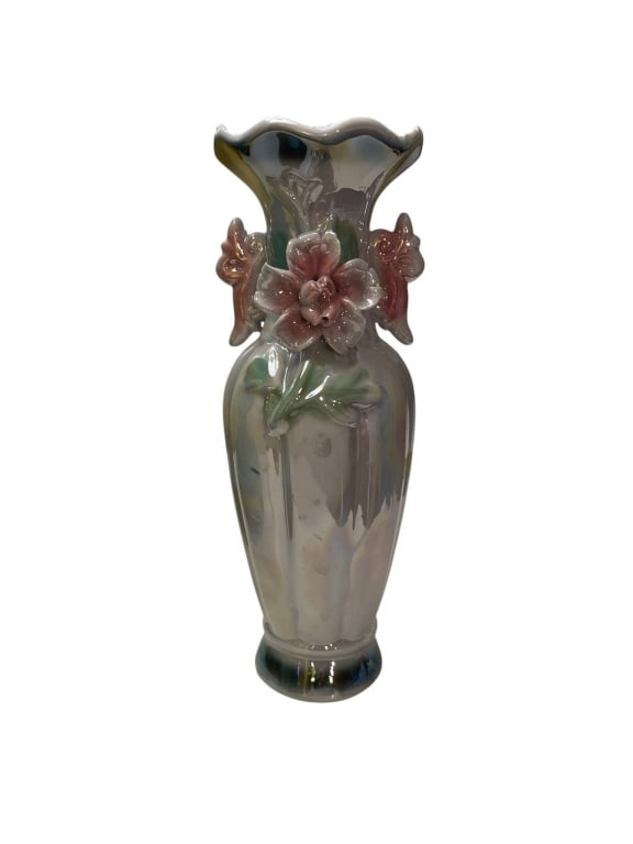 IRIDESCENT CERAMIC VASE WITH FLORAL DESIGN 8": This is a ceramic vase with an iridescent glaze, beautifully adorned with a raised pink flower and butterfly motifs. The vase measures approximately 8 inches tall and 4 inches wide. It is in good cond