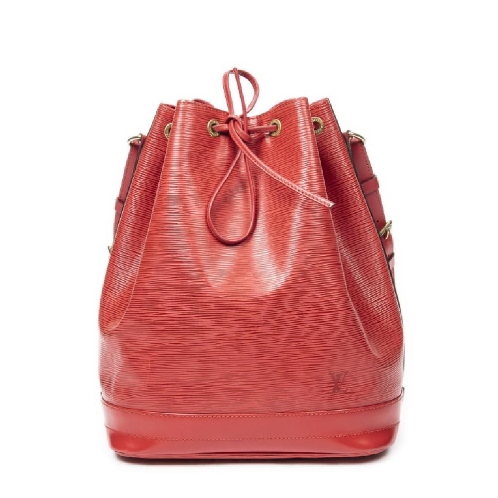 LOUIS VUITTON NOE GM RED EPI BAG: The Louis Vuitton Noe GM is a classic bucket bag crafted in vibrant red Epi leather, showcasing the maison's signature textured finish and enduring craftsmanship. Originally created to carry champagne