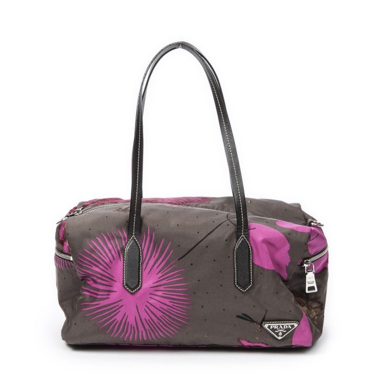 PRADA ZIP BOSTON STAMPATO CANVAS SHOULDER BAG: The Prada Zip Boston is crafted in stylish grey and pink Nylon Stampato canvas with sleek silver-tone hardware, offering a modern and sporty take on a classic silhouette. Its spacious Boston-style des