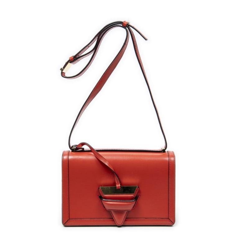 LOEWE MEDIUM BARCELONA RED CALFSKIN SHOULDER BAG: The Loewe Medium Barcelona is a sophisticated shoulder bag crafted in luxurious red calfskin leather and accented with elegant gold-tone hardware. Defined by its sleek geometric silhouette and signatu