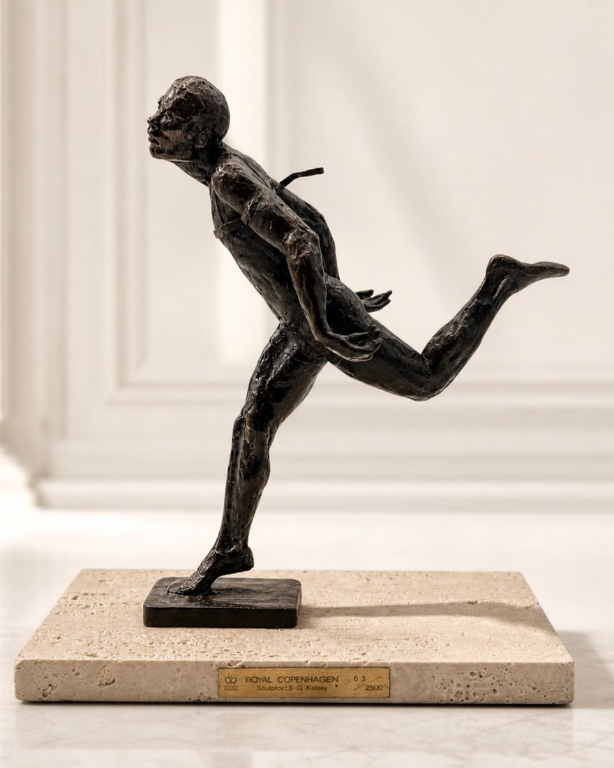 ROYAL COPENHAGEN S-G KELSEY LTD ED RUNNER STATUE: Striking Royal Copenhagen limited edition figural sculpture by S-G Kelsey, depicting an athletic runner in dynamic forward motion with expressive modernist modeling and a dark patinated finish. The