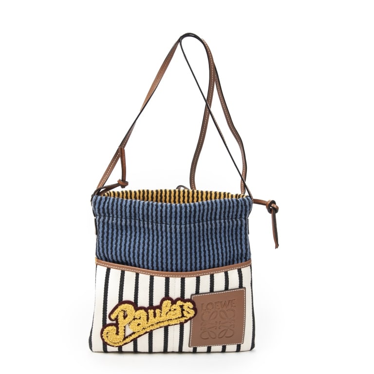LOEWE EMBROIDERED STRIPED CANVAS SHOULDER BAG: The Loewe Embroidered Drawstring Pouch Crossbody showcases a relaxed yet sophisticated design crafted in blue and tan striped canvas. Accented with intricate embroidered details and a versatile