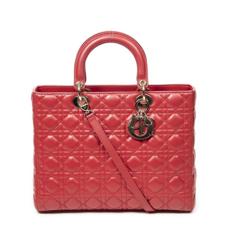 DIOR LADY DIOR LARGE RED CANNAGE LEATHER BAG: The Dior Lady Dior Large is an iconic luxury handbag crafted in rich red Cannage lambskin leather. Showcasing the house's signature quilted Cannage pattern and timeless architectural silhouette, this