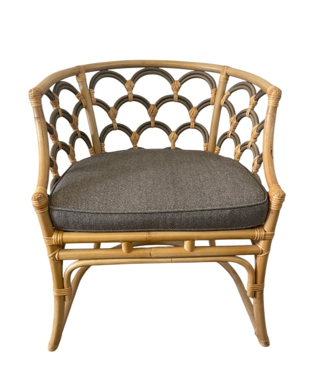 RATTAN BARREL BACK ACCENT CHAIR WITH CUSHION 31": Rattan barrel back accent chair featuring a warm natural bamboo/rattan frame with curved arms, rounded front posts, and decorative looped lattice back and side panels. The chair has a stylish coastal,