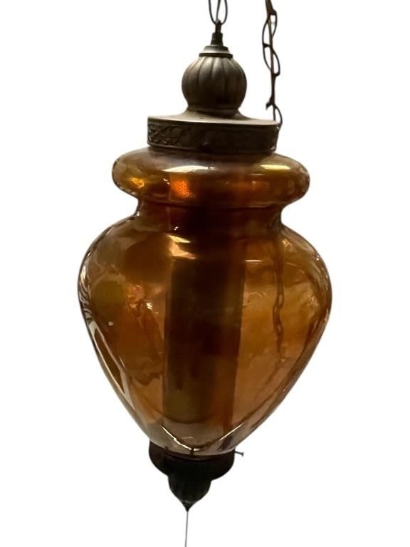 MID CENTURY AMBER ART GLASS HANGING ARTISAN LAMP: Vintage hanging pendant light featuring a hand-blown amber glass shade with a bulbous, urn-form silhouette. The glass exhibits warm honey tones with natural variations and subtle surface irregularitie
