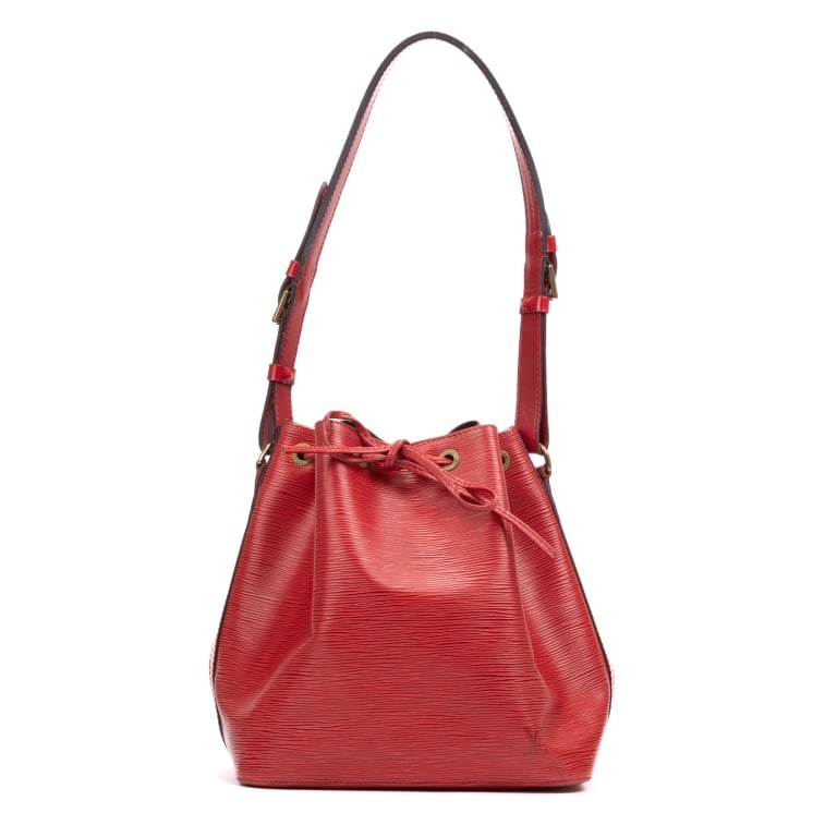 LOUIS VUITTON NOE PM RED EPI BAG: The Louis Vuitton Noe PM is a timeless bucket bag crafted in vibrant red Epi leather, showcasing the house's signature textured finish and exceptional craftsmanship. Originally designed to carry champ