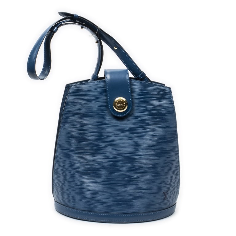 LOUIS VUITTON CLUNY BLUE EPI BAG: The Louis Vuitton Cluny is a timeless classic crafted in rich blue Epi leather and accented with elegant golden brass hardware. Featuring a structured silhouette and spacious interior, this iconic des