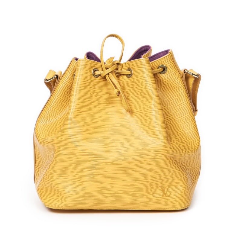 LOUIS VUITTON NOE PM YELLOW EPI BAG: The Louis Vuitton Noe PM is a timeless bucket bag crafted in vibrant yellow Epi leather, showcasing the house's signature textured finish and exceptional craftsmanship. Originally designed to carry ch