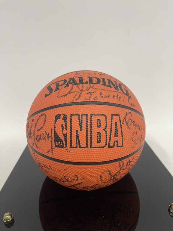 1997 NBA CRUISE SIGNED MINI BASKETBALL IN CASE 12": Souvenir-size Spalding mini basketball displayed in a black acrylic presentation case with plaque reading ?N.B.A. Cruise - 1997.? The basketball appears to be signed by multiple individuals, though