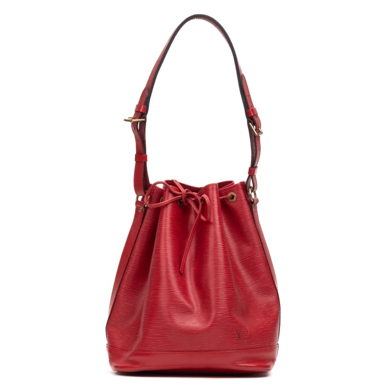 LOUIS VUITTON NOE GM RED EPI BAG: The Louis Vuitton Noe GM is a timeless bucket bag crafted in vibrant red Epi leather, showcasing the maison's signature textured finish and enduring craftsmanship. Originally created to carry