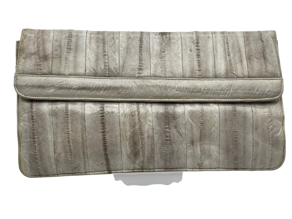 VINTAGE SOFT GRAY TEXTURED EELSKIN ENVELOPE BAG: Unsigned vintage circa 80's bag in eelskin Lovely textured grayTerra Cotta liningIn Very Good condition! msn* By bidding on this listing, you understand and agree to be bound by the terms and