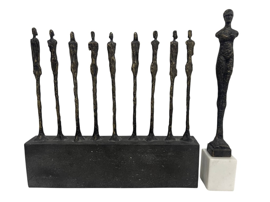 MODERNIST BRUTALIST FIGURATIVE SCULPTURES 2PC LOT: Two modernist sculptures featuring elongated slendered standing figures done after the style of Alberto Giacometti (Swiss, 1901 - 1966). The single figure sculpture is metal on a marble base. The larg