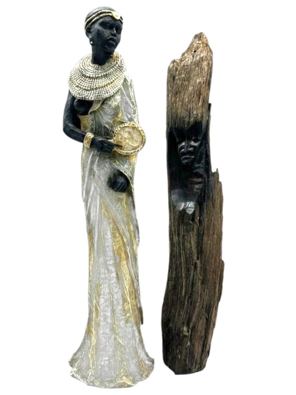2 PCS AFRICAN STYLE WOODEN SCULPTURES 22": Decorative two-piece African-inspired carved sculpture collection comprising a hand-carved standing female figure and a striking carved mask-form sculpture integrated into a natural wood trunk. The