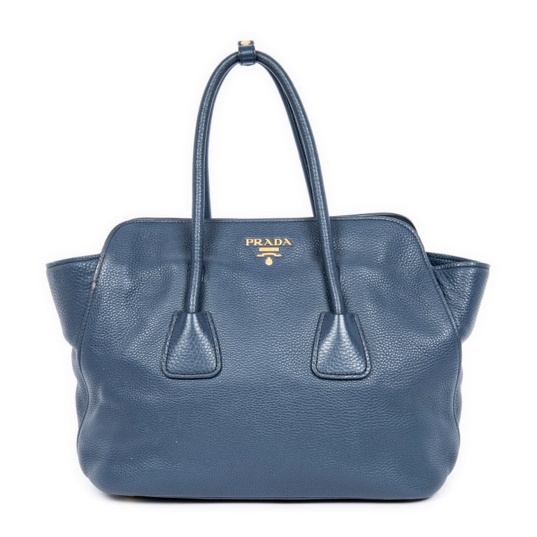 PRADA DARK BLUE GRAINED LEATHER TOTE BAG: The Prada Open Shopping Tote is crafted in luxurious dark blue grained calfskin leather and accented with elegant gold-tone hardware. Featuring a spacious open-top design and timeless silhouette,