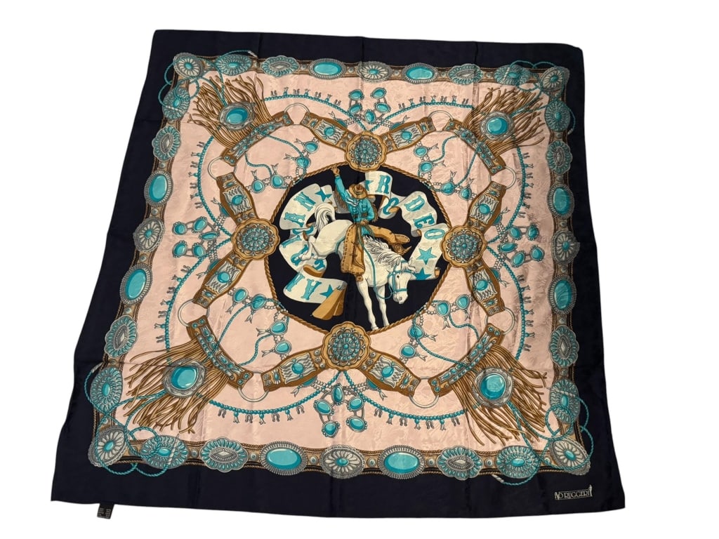 V. RUGGERI WESTERN JEWELRY SILK SCARF: V. RUGGERI WESTERN JEWELRY SILK SCARFVintage V. Ruggeri silk scarf featuring an eye-catching Western-inspired design centered around a cowboy on horseback, surrounded by turquoise jewelry motifs, conc