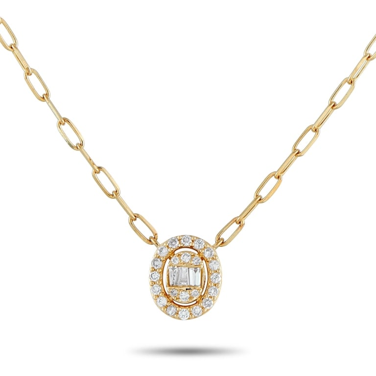 14K YELLOW GOLD 0.30CT DIAMOND CLUSTER OVAL HALO N: This 14K yellow gold necklace presents a design that is effortless and light, yet deliberate and refined. It features a petite oval pendant with a cluster of round and baguette diamonds at its center.