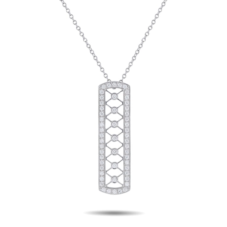 TIFFANY & CO. VOILE PLATINUM 0.30CT DIAMOND BAR NE: This Tiffany & Co. Voile Bar necklace features intricate Platinum metalwork in an openwork design. Diamonds with a total weight of 0.30 carats enhance the appeal of this delicate, airy accessory. The 