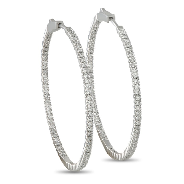 14K WHITE GOLD 1.56CT DIAMOND INSIDE-OUT HOOP EARR: Add a touch of sophistication to any outfit with these elegant hoop earrings. Crafted from 14K White Gold, the classic design is elevated by sparkling Diamonds totaling 1.56 carats. Each earring measu