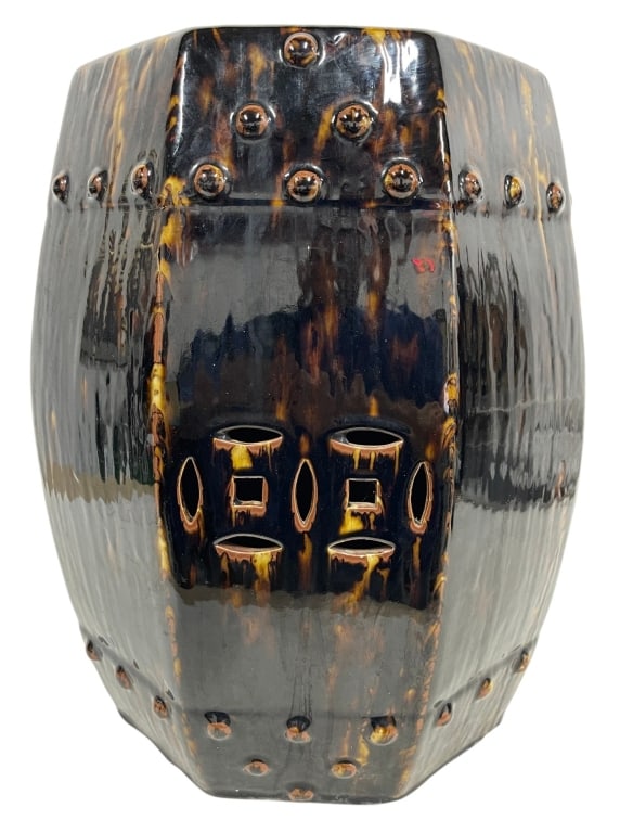 CERAMIC GARDEN STOOL WITH TORTOISESHELL GLAZE 18": Striking contemporary ceramic garden stool featuring a rich tortoiseshell-style glaze in deep espresso, amber, and caramel tones. The faceted octagonal form is accented with raised stud detailing and 
