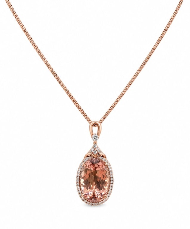 14K ROSE GOLD 31CT MORGANITE DIAMOND NECKLACE: 14K karat rose gold necklace featuring a natural oval-cut morganite weighing approximately 31.78 carats. The pendant is accented by round brilliant-cut diamonds totaling approximately 0.97 carat and s