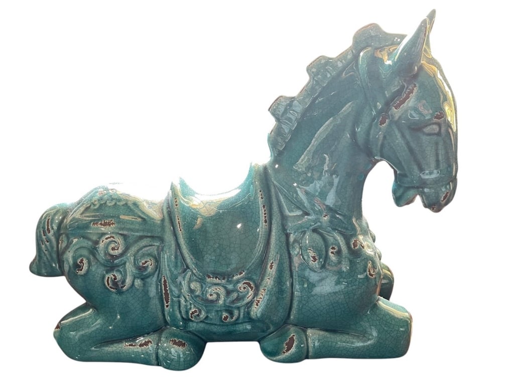 VINTAGE BLUE GREEN CERAMIC HORSE FIGURINE 18": Decorative ceramic figurine of a reclining horse finished in blue-green glaze. Intricate detailing and saddle design. Likely mid-to-late 20th century. Perfect as a decorative accent or collectible pie