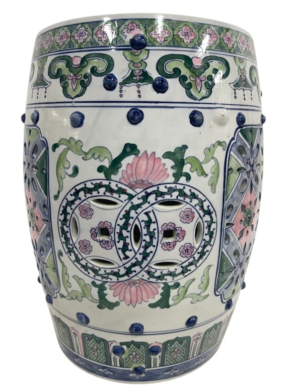 CHINESE STYLE PIERCED GARDEN SEAT 18": Decorative Chinese-style ceramic garden seat featuring a pierced double-coin motif, hand-painted floral and foliate decoration in soft pink, green, and blue tones, and raised cobalt-style stud accents