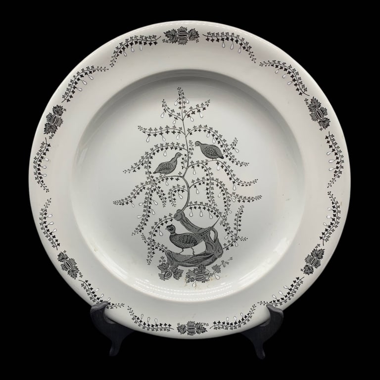 WEDGWOOD ENGLAND DINNER PLATE FLORAL BIRD 12.5": Wedgwood of Etruria & Barlaston dinner plate, made in England. Features a black floral and bird motif with decorative border. Classic collectible English pottery piece, ideal for display or use.