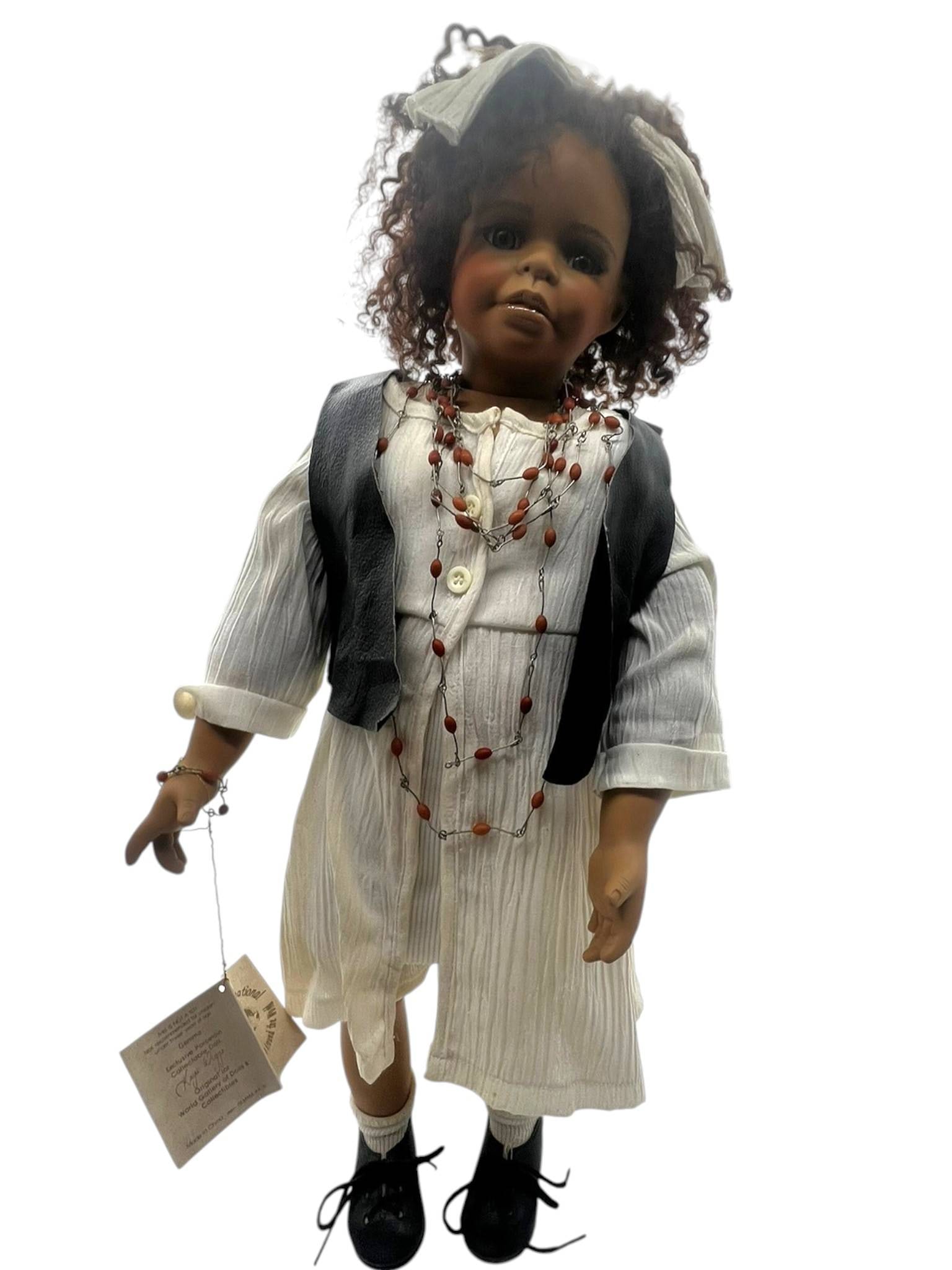 KAYE WIGGS COLLECTIBLE DOLL "GEMMA" 23": Signed Kaye Wiggs “Gemma” exclusive porcelain collectible doll, copyright 1996, numbered 2089/2500, produced for World Gallery of Dolls & Collectibles, with original hang tag, white textured o