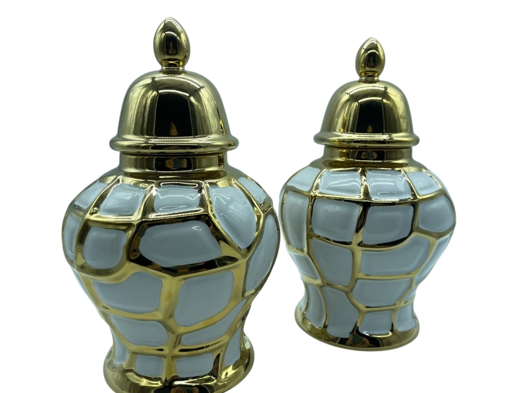 DECORATIVE WHITE & GOLD CERAMIC GINGER JARS: Enhance your home decor with this elegant pair of decorative ceramic ginger jars, featuring a sophisticated white glazed finish accented by an eye-catching gold-tone geometric mosaic pattern. These li