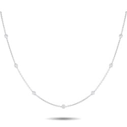 18K WHITE GOLD 0.75CT DIAMOND STATION NECKLACE ANK: This sophisticated necklace will make a subtle statement. Set in 18K White Gold, the delicate chain is elevated by a series of bezel set Diamonds totaling 0.75 carats. Ideal for everyday wear, this im