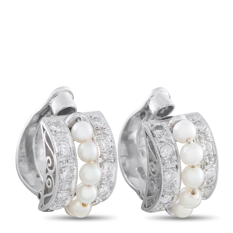 PLATINUM 0.40CT DIAMOND AND PEARL CLIP-ON EARRINGS: These earrings feature a classically elegant design that will never go out of style. Set in Platinum, a series of Pearls accent the center of the curved design. Diamonds with a total weight of 0.40 ca
