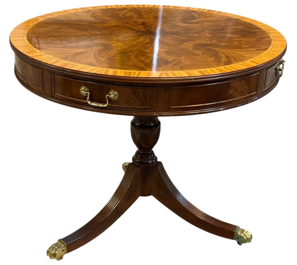 LEOPOLD STICKLEY MAHOGANY DRUM GUERIDON TABLE 27": Leopold Stickley round mahogany drum-form gueridon table featuring an inlaid sunburst veneer top and four concealed drawers with brass pulls. The table stands on a turned pedestal with three splayed l